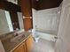 Bathroom featuring a vanity with sink, toilet, and tiled bathtub/shower combination at 3109 Chessington Dr, Land O Lakes, FL 34638