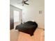 Bedroom showcasing a ceiling fan and natural light from a window at 32699 Dashel Palm Ln, Wesley Chapel, FL 33543
