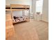 Bedroom features a wooden bunk bed and a bright sunny window at 32699 Dashel Palm Ln, Wesley Chapel, FL 33543