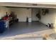 Spacious garage, perfect for parking and storage with bikes hanging at 32699 Dashel Palm Ln, Wesley Chapel, FL 33543