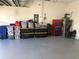 Large garage with painted flooring and ample storage at 32699 Dashel Palm Ln, Wesley Chapel, FL 33543