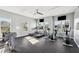 Community gym with treadmills, elliptical machines, weights, and large windows at 32699 Dashel Palm Ln, Wesley Chapel, FL 33543