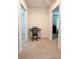 Hallway featuring neutral carpet and black piano keyboard at 32699 Dashel Palm Ln, Wesley Chapel, FL 33543