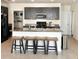 Kitchen featuring an island with seating, stainless steel appliances, and granite countertops at 32699 Dashel Palm Ln, Wesley Chapel, FL 33543