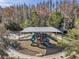 Community playground with slides and play structures set in a natural environment at 32699 Dashel Palm Ln, Wesley Chapel, FL 33543