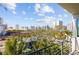 Enjoy city views from a private balcony with beautiful blue skies and city architecture at 332 Cocoanut Ave # 505, Sarasota, FL 34236