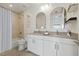 Modern bathroom with double vanity, neutral tiling, and shower-tub combination at 332 Cocoanut Ave # 505, Sarasota, FL 34236
