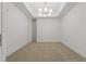Bright bedroom features neutral carpeting, clean white walls, and contemporary light fixture at 332 Cocoanut Ave # 505, Sarasota, FL 34236
