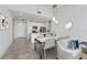 Modern dining area flowing from living room and kitchen with bright interior and dining table at 332 Cocoanut Ave # 505, Sarasota, FL 34236
