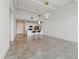 Spacious kitchen with sleek white cabinetry, island seating, and stainless steel appliances at 332 Cocoanut Ave # 505, Sarasota, FL 34236