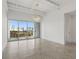 Spacious living room featuring neutral colors, modern lighting, and a balcony at 332 Cocoanut Ave # 505, Sarasota, FL 34236