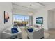 Bright living room with city views, balcony, modern lighting, and neutral tones for a serene atmosphere at 332 Cocoanut Ave # 505, Sarasota, FL 34236