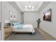 Serene bedroom featuring modern decor, ample natural light, and a TV for a relaxing retreat at 332 Cocoanut Ave # 505, Sarasota, FL 34236
