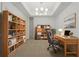 A bright office with an organized workspace, stylish furnishings, and ample built-in shelving at 332 Cocoanut Ave # 505, Sarasota, FL 34236