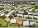 Beautiful aerial view of home in a scenic community with lake and golf course views at 3928 90Th N Ter, Pinellas Park, FL 33782