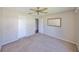 Bedroom showcasing neutral carpet and a mirror, providing a serene and comfortable space at 3928 90Th N Ter, Pinellas Park, FL 33782