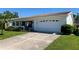 Charming single-story home featuring a two-car garage and well-maintained landscaping at 3928 90Th N Ter, Pinellas Park, FL 33782