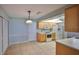 Open kitchen with tile floors, wooden cabinets, and adjacent dining area at 3928 90Th N Ter, Pinellas Park, FL 33782