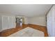 Bright living room with hardwood floors, a neutral color scheme, and large windows with sheer curtains at 3928 90Th N Ter, Pinellas Park, FL 33782