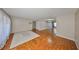 Spacious living room with hardwood floors, neutral walls, and a bright, open layout at 3928 90Th N Ter, Pinellas Park, FL 33782