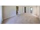 Spacious main bedroom has neutral carpet, multiple closets, and ensuite bathroom at 3928 90Th N Ter, Pinellas Park, FL 33782