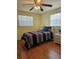 Bedroom with a ceiling fan and windows on either side of the bed at 4206 Tamargo Dr # 4206, New Port Richey, FL 34652
