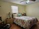 A cozy bedroom features a comfortable bed, a ceiling fan, and a window with blinds at 4206 Tamargo Dr # 4206, New Port Richey, FL 34652