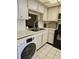 Kitchen featuring stainless steel sink, white washer and modern appliances at 4206 Tamargo Dr # 4206, New Port Richey, FL 34652