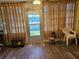 A screened patio with a view to the back, featuring comfortable flooring and natural light at 4206 Tamargo Dr # 4206, New Port Richey, FL 34652