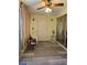 This screened patio features neutral walls, a fan, and vinyl flooring at 4206 Tamargo Dr # 4206, New Port Richey, FL 34652