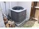 Home's A/C unit on a concrete slab near the fence at 4363 Elwood Rd, Spring Hill, FL 34609
