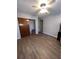Bedroom with hardwood flooring, light gray painted walls, ceiling fan and sliding closet doors at 4363 Elwood Rd, Spring Hill, FL 34609