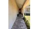 Charming entrance walkway with plants on each side, leading to the front door at 4363 Elwood Rd, Spring Hill, FL 34609