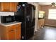Modern kitchen with stainless steel refrigerator, microwave and wooden cabinets at 4363 Elwood Rd, Spring Hill, FL 34609