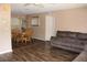 Open-concept living room featuring hardwood floors, a dining area, and comfortable seating at 4363 Elwood Rd, Spring Hill, FL 34609