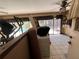 View of the living room with sliding glass doors that lead to the pool area at 4363 Elwood Rd, Spring Hill, FL 34609