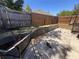 Fenced patio with chairs and a small wall between the fence lines at 4363 Elwood Rd, Spring Hill, FL 34609