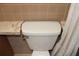 Toilet surrounded by tan tile and a white shower curtain in bathroom at 4363 Elwood Rd, Spring Hill, FL 34609