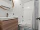 Bathroom featuring modern vanity, toilet, and shower/tub combo with patterned shower curtain at 4400 2Nd S Ave, St Petersburg, FL 33711