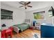 bedroom featuring hardwood floors, natural light, a ceiling fan, and space for activities at 4400 2Nd S Ave, St Petersburg, FL 33711