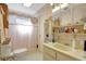 Classic bathroom with vanity, toilet, and shower, well lit by natural light at 4610 47Th N Way, St Petersburg, FL 33702