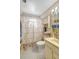 Bathroom features a shower with curtain, vanity with sink, and cabinet storage, providing a functional space at 4610 47Th N Way, St Petersburg, FL 33702