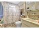 Practical bathroom featuring a shower-tub combination, vanity with sink, and storage cabinet, making it quite functional at 4610 47Th N Way, St Petersburg, FL 33702