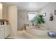Bathroom showcasing a luxurious soaking tub and ample counter space at 4610 47Th N Way, St Petersburg, FL 33702