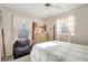 Inviting bedroom with bright sunlight, a quilted bedspread, and classic furnishings, offering a cozy and comfortable retreat at 4610 47Th N Way, St Petersburg, FL 33702