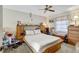 Bedroom with built-in storage, ceiling fan and carpet flooring, natural light at 4610 47Th N Way, St Petersburg, FL 33702