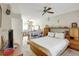 Bedroom with built-in storage, ceiling fan, and a small seating area at 4610 47Th N Way, St Petersburg, FL 33702