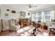 Bright bedroom featuring natural light, ceiling fan, and cozy desk area at 4610 47Th N Way, St Petersburg, FL 33702