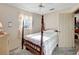 Cozy bedroom filled with natural light, featuring a four-poster bed with a quilted bedspread and peaceful ambiance at 4610 47Th N Way, St Petersburg, FL 33702