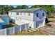 Rear exterior showing a two-story home with a garage, backyard space, and potential for outdoor living and enhancements at 4610 47Th N Way, St Petersburg, FL 33702